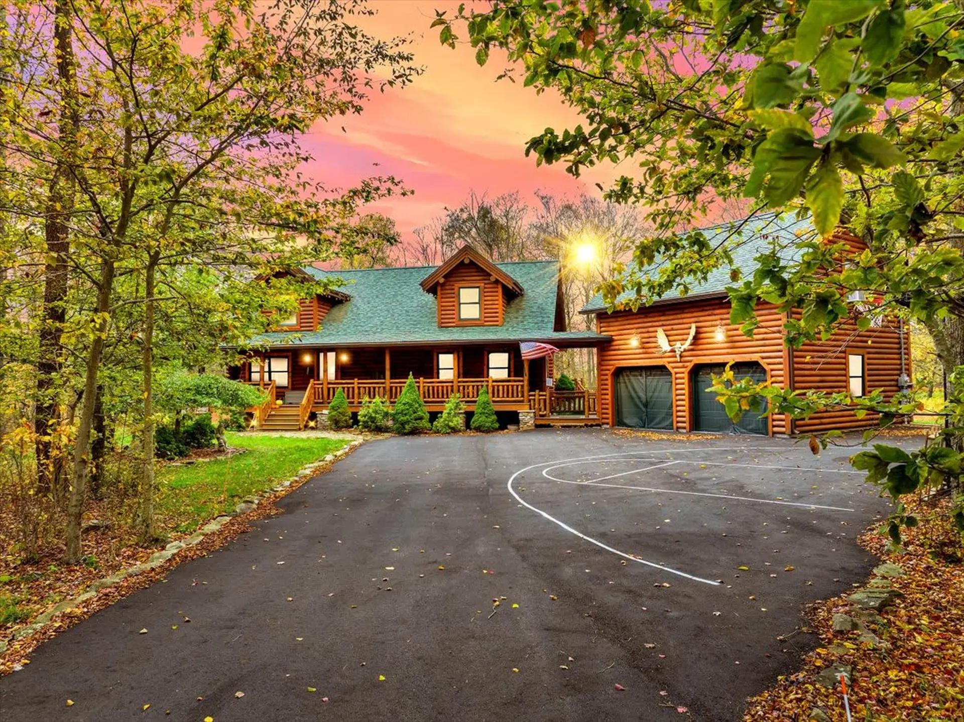 Cozy log cabin vacation rental in a wooded Poconos setting