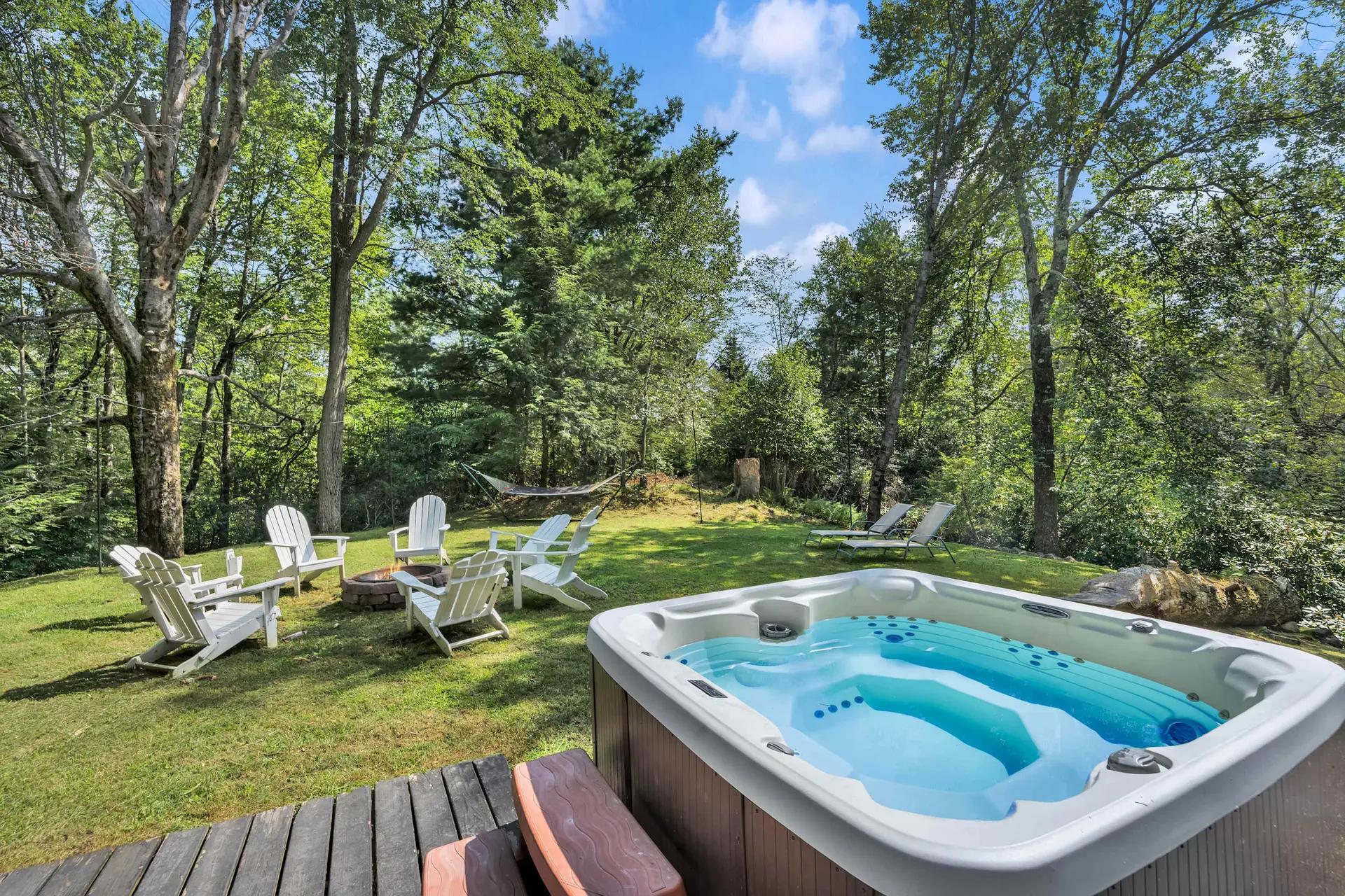 Private hot tub on a secluded deck surrounded by trees